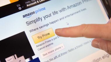 Amazon Sign in page of Website with a finger touching the screen.