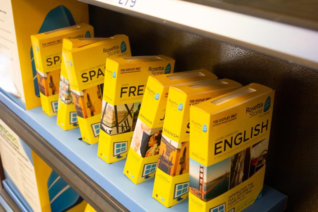 Several yellow cases of Rosetta Stone language education software bundles for sale at a local bookstore.