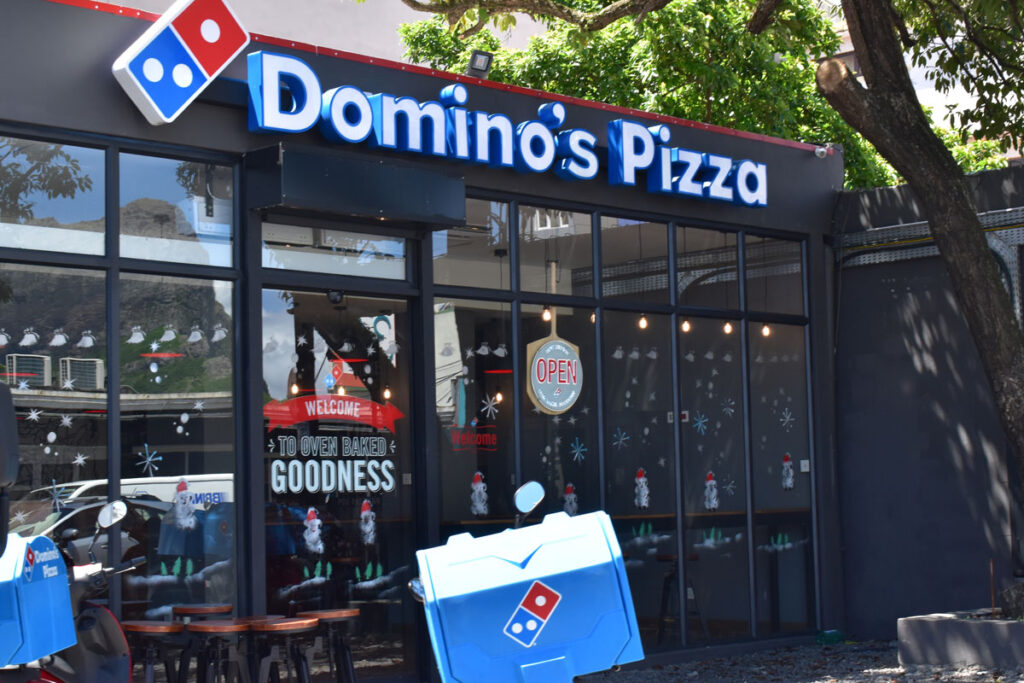 Exterior of a Domino's in New York, representing the state attorney general's settlement.
