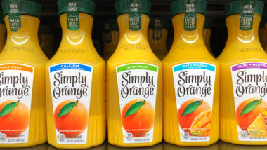 Simply Orange bottles for sale on a grocery store shelf.