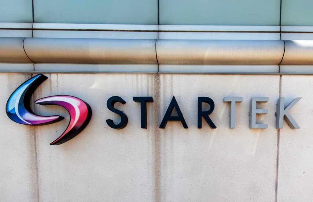 Close up of Startek signage on exterior of a building, representing the Startek data breach settlement.