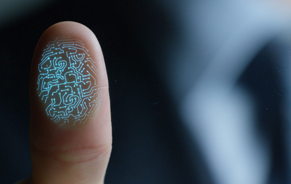 Close up of a business man scanning his fingerprint, representing the Connor Group settlement.