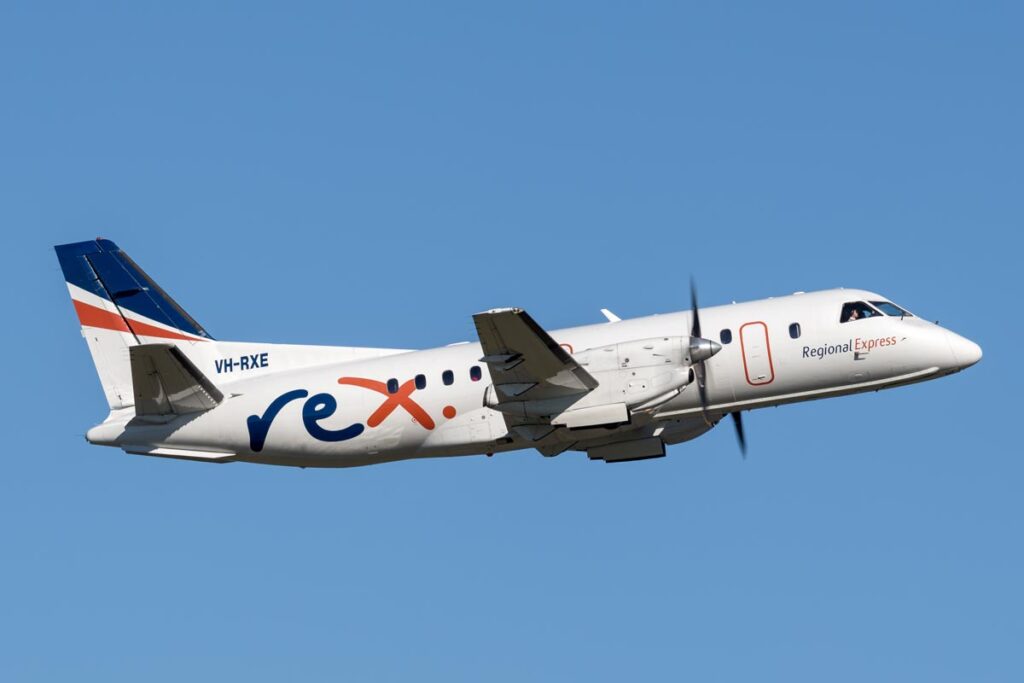 A Regional Express plane flying in the air.