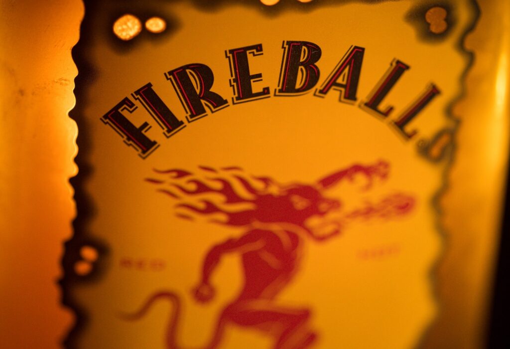 A Fireball label is shown, representing the Fireball Cinnamon class action lawsuit.
