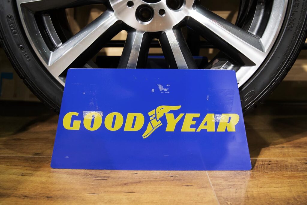 Goodyear logo in front of a tire.