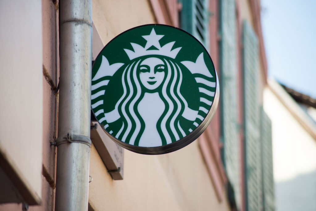 Closeup of Starbucks logo on signboard on store front - Starbucks Sprouted Grain bagel class action