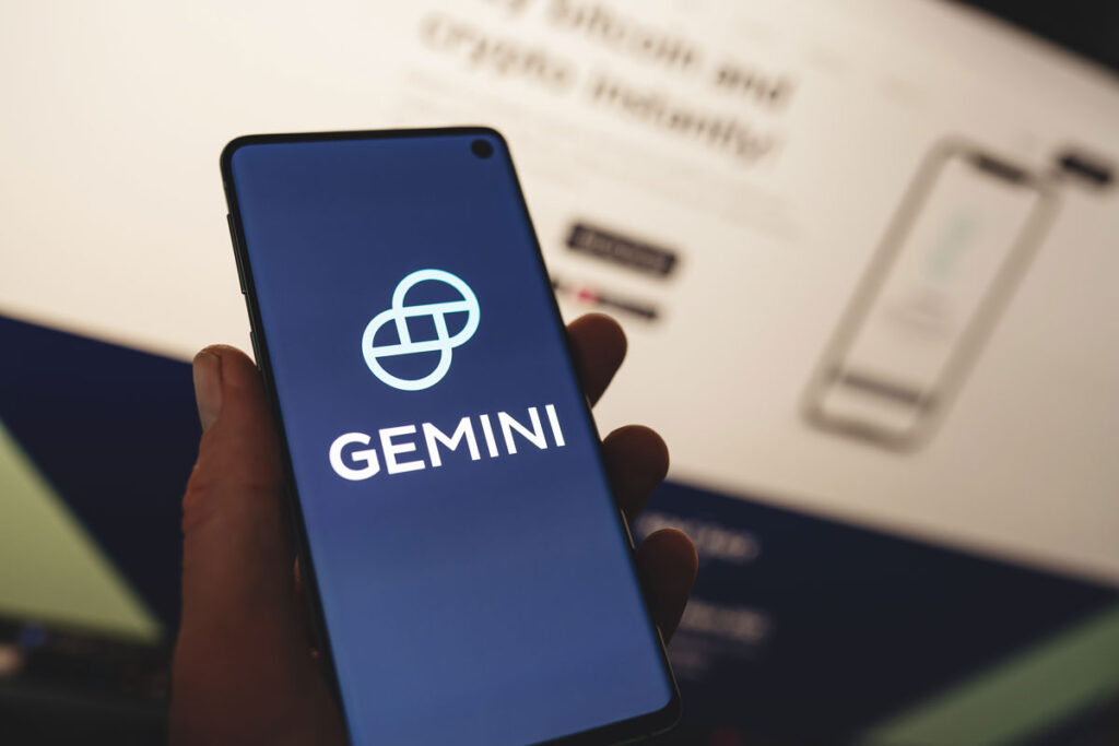Close up the Gemini logo displayed on a smartphone screen.