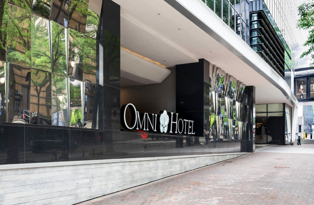 Perspective view of Omni Hotel sign and logo.