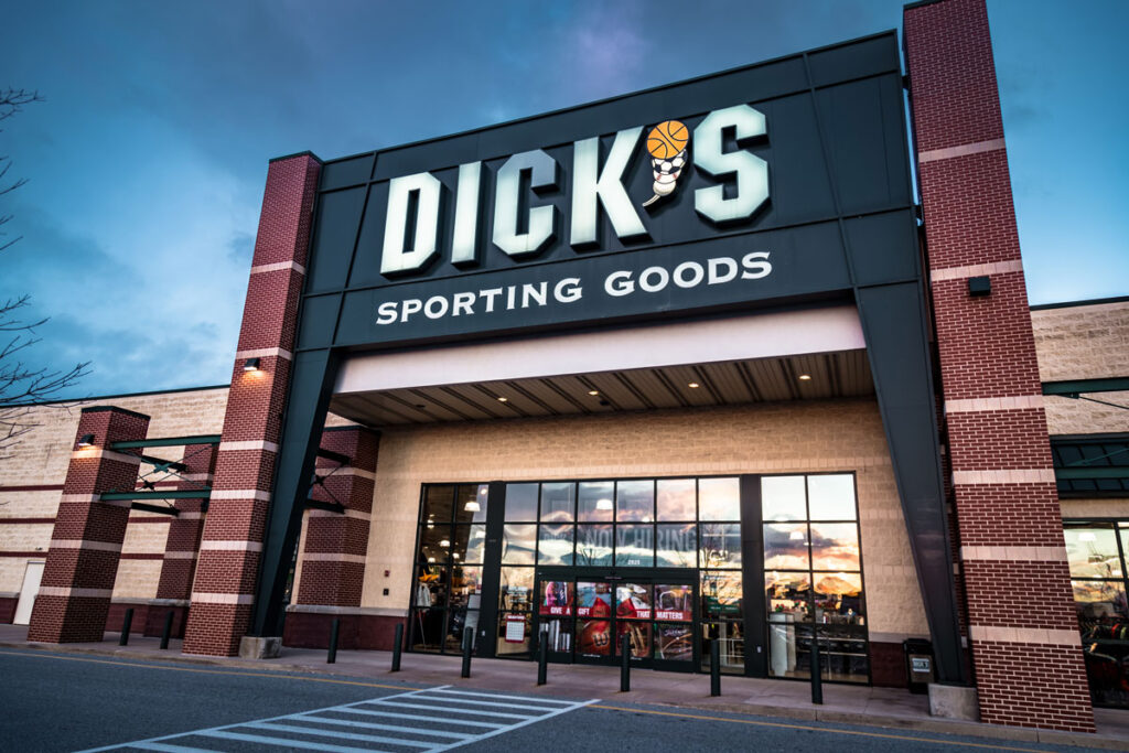 Exterior of Dick's Sporting Goods retail store including sign and logo.