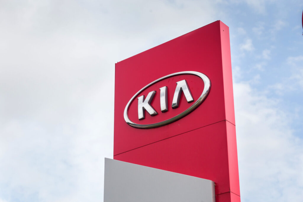 A Kia sign is seen at a dealership, representing a Hyundai Kia ABS class action lawsuit.