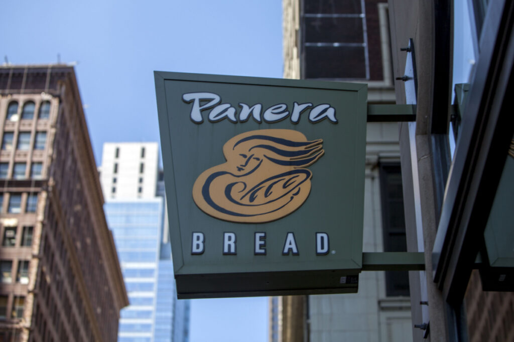 Panera Sign hanging outside on building