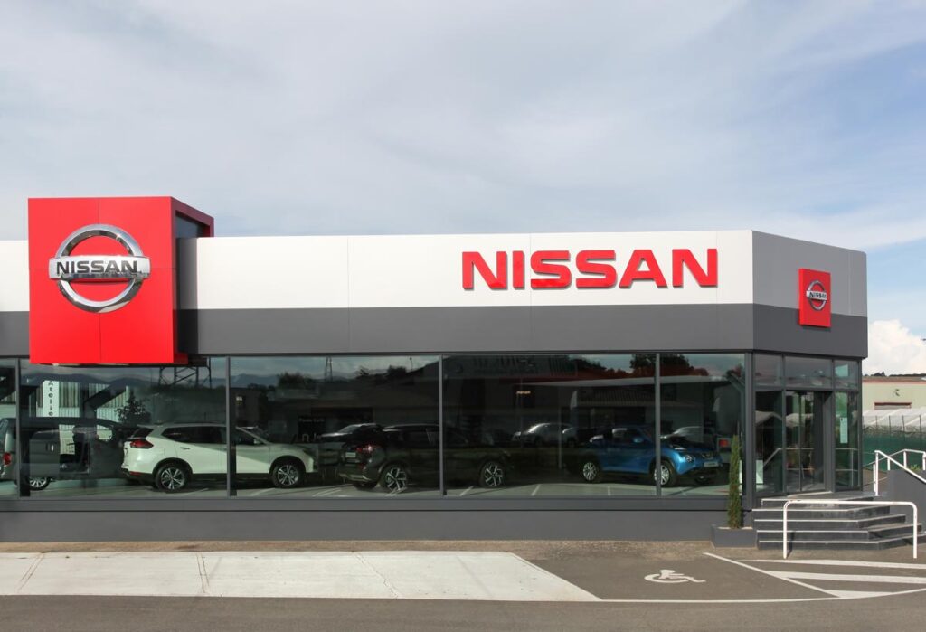 Exterior of a Nissan dealership.