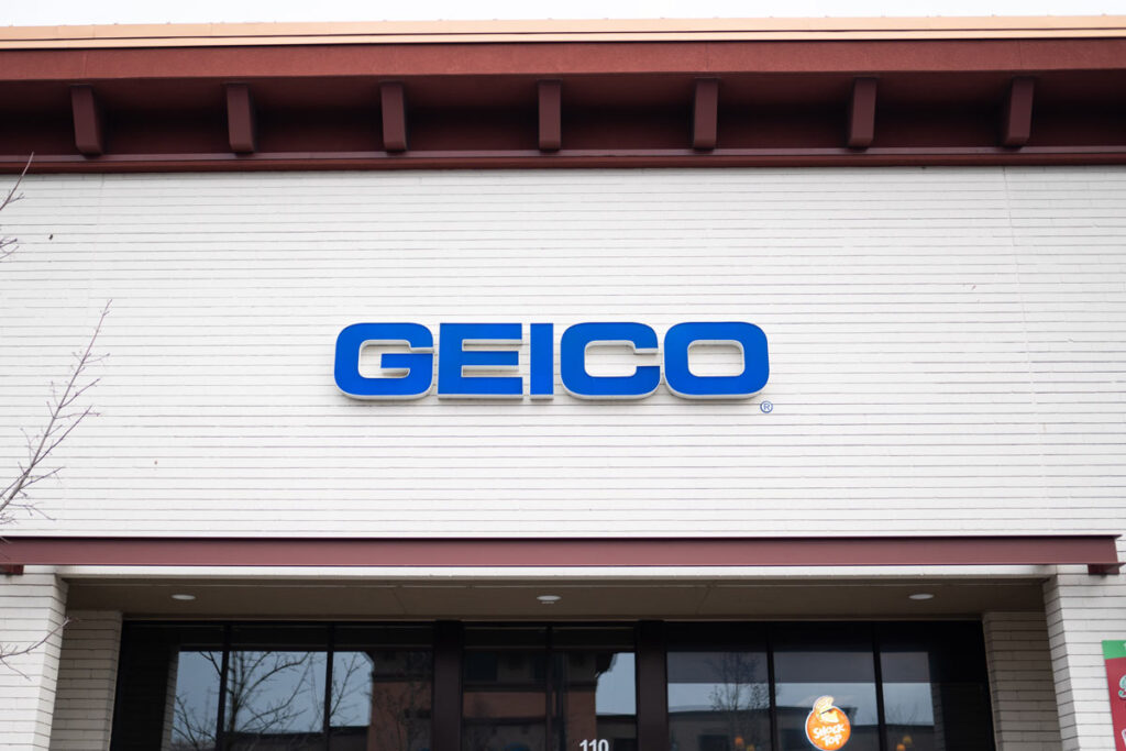 Geico insurance business front with a blue logo.