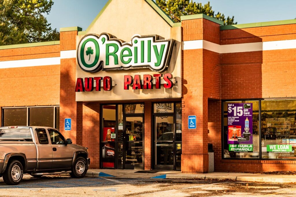 Exterior of O'Reilly's auto parts during golden hour, representing the O’Reilly Auto Parts FCRA settlement.
