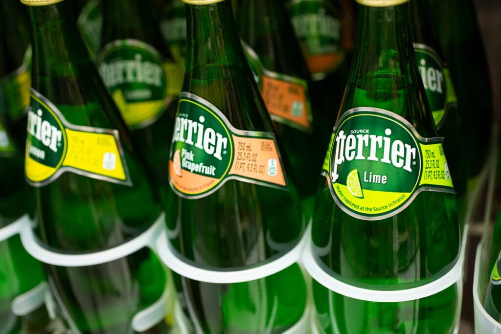 A closeup view of several Perrier bottles, seen at a local liquor store.