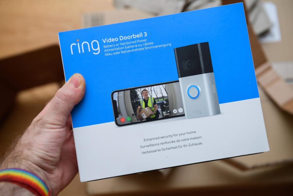 POV male hand holding before unboxing recent parcel with package of new latest Amazon Ring Video Doorbell 3.