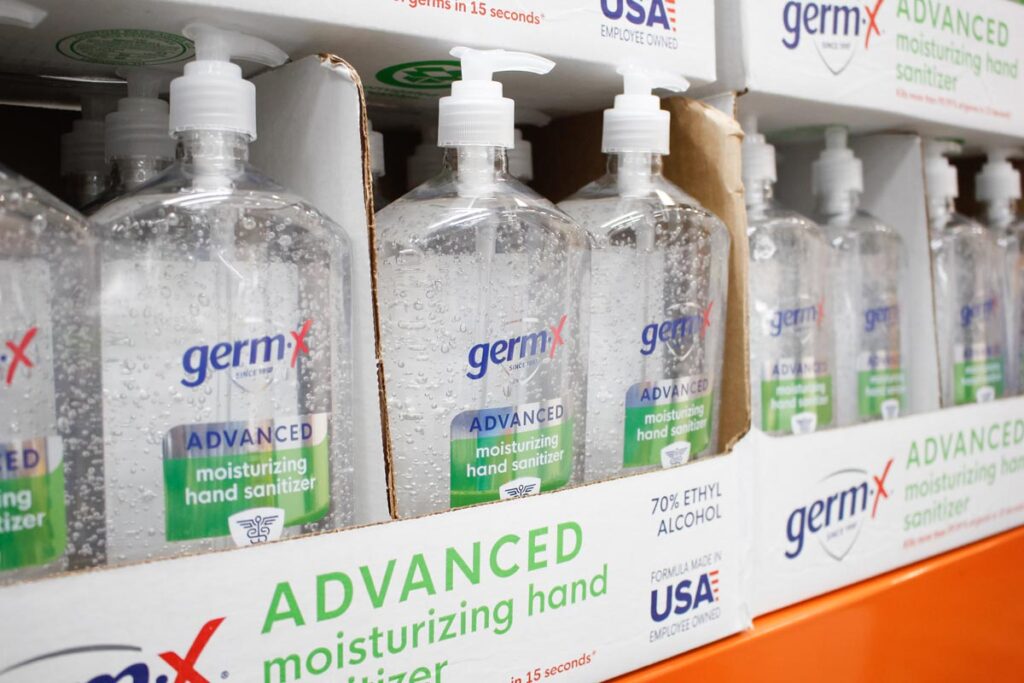 Close up of several containers of Germ X moisturizing hand sanitizer, on display at a local big box grocery store.
