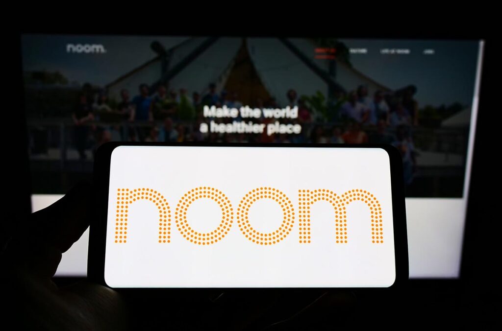 Close up of Noom logo seen a smartphone screen, representing the Noom class action.