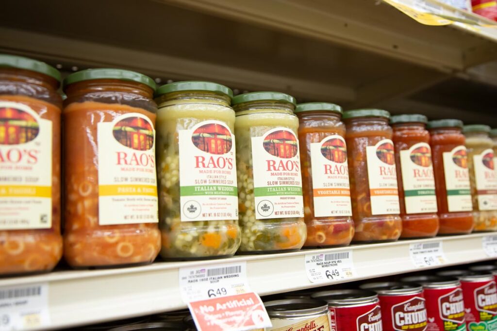 A view of several jars of Rao's soups on display at a local grocery store, representing the Rao's soup recall.