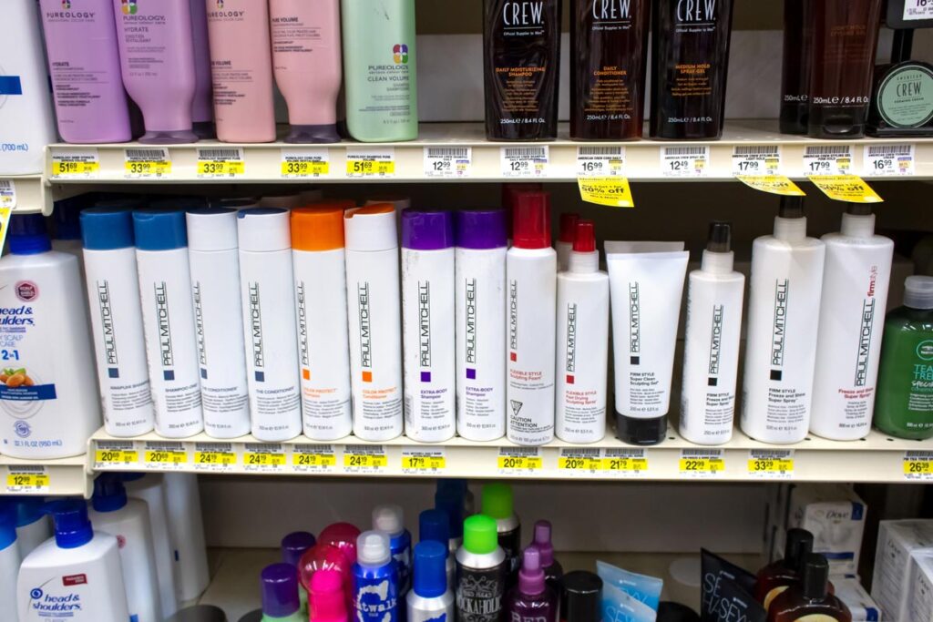 A view of a shelf of several Paul Mitchell hair products on display at a local retail store, representing the John Paul Mitchell animal testing class action lawsuit.