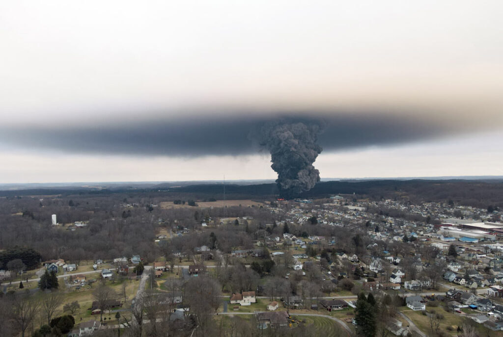 An aerial view of a mushroom cloud after authorities performed a controlled release of chemicals after a massive train derailment, representing the Norfolk Southern derailment class action.