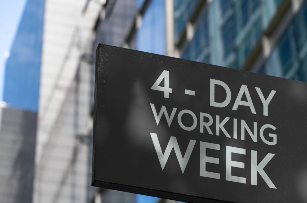 Sign on a building that reads "4-Day Working Week"