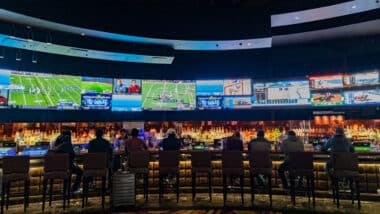 People watching multiple TVs with sports on them