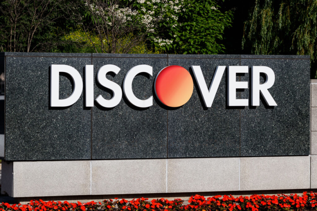 A Discover sign is seen outside, representing the Discover class action lawsuit settlement.