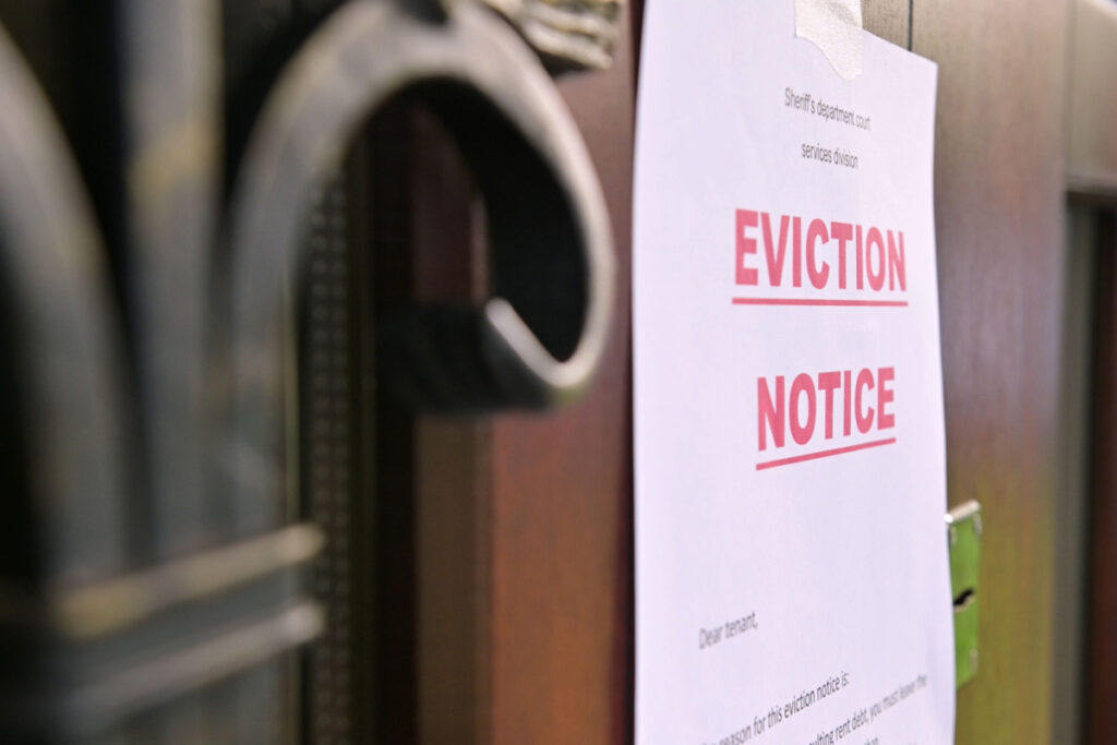 An Eviction Notice on door, representing the North Carolina eviction fees settlement.