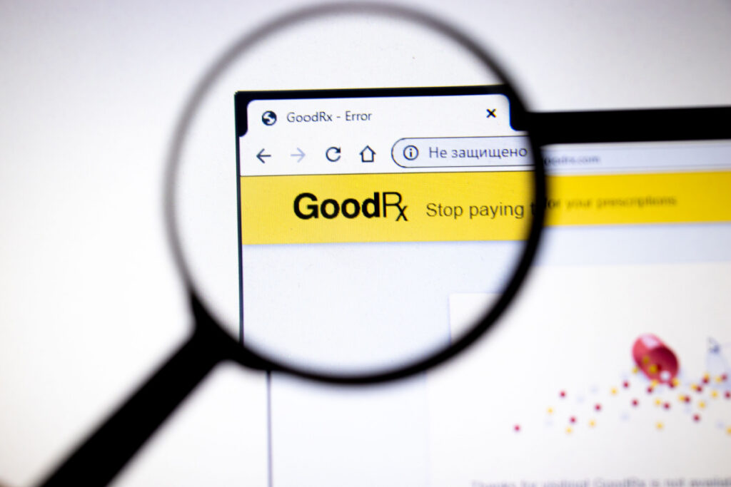 Magnifying glass looking at GoodRX website
