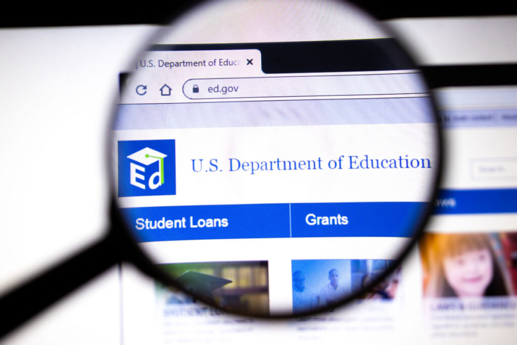 A magnifying glass looking at the US Department of Education website