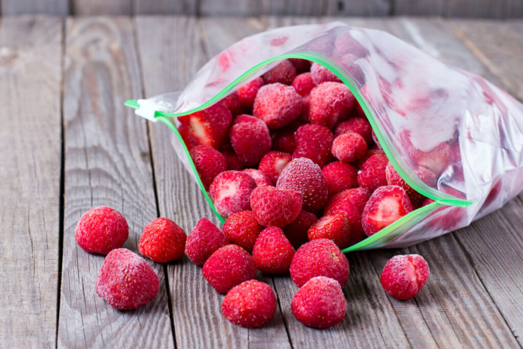 An opened zip-top bag of frozen strawberries is shown. Scenic Fruit Co. has initiated a frozen organic strawberry and frozen organic tropical blend recall due to possible hepatitis A contamination.