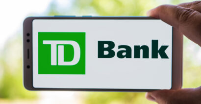 Person Holding Cellphone with TD Bank logo on screen