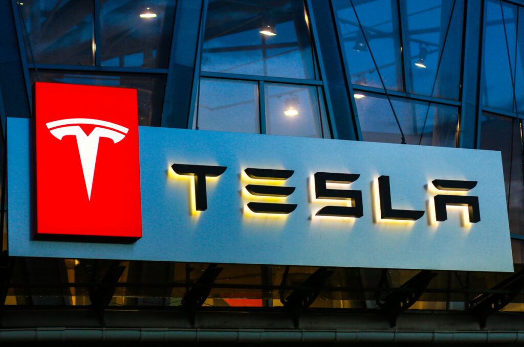 Tesla sign with Logo outside showroom