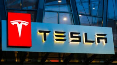 Tesla sign with Logo outside showroom