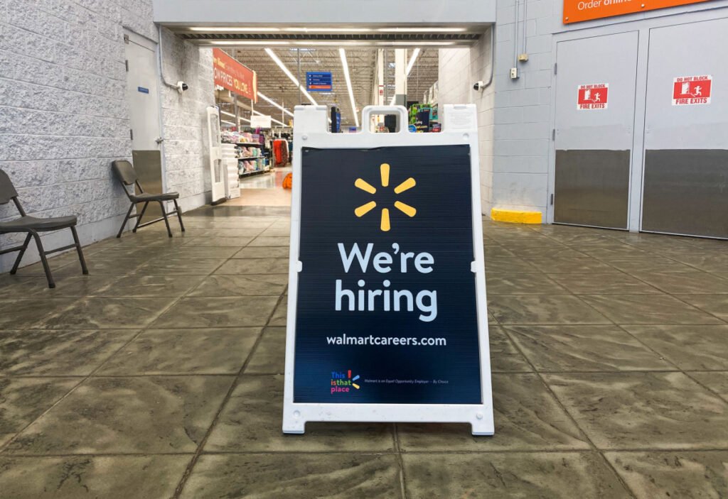 Sign up at the front door of the Walmart reading "We are hiring"