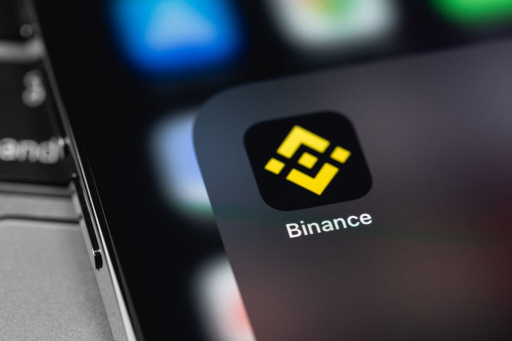The Binance app is seen on a cellphone. Binance Holdings agreed to pay $4.3 billion as part of a proposed plea agreement with the Department of Justice (DOJ) to end claims the crypto exchange violated sanctions and engaged in money laundering and bank fraud.