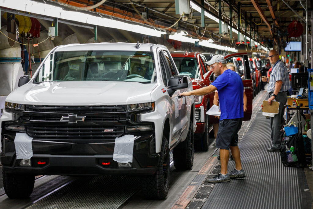 Trucks come off the assembly line at GM's Chevrolet Silverado and GMC Sierra pickup truck plant, representing the CP4 fuel pump lawsuit.