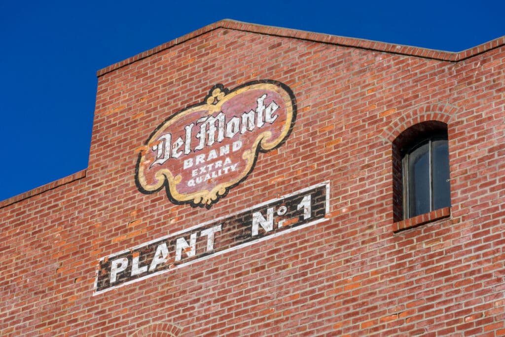 Del Monte painted sign on brick building