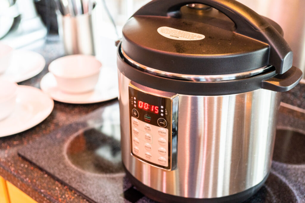 A pressure cooker sits on a kitchen counter, representing the Cuisinart pressure cooker class action