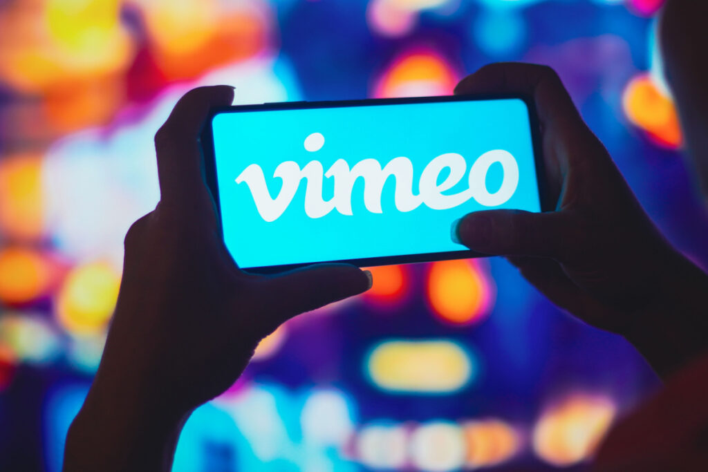 The Vimeo logo is seen on a cellphone, representing Vimeo and Magisto BIPA biometric privacy lawsuit settlement