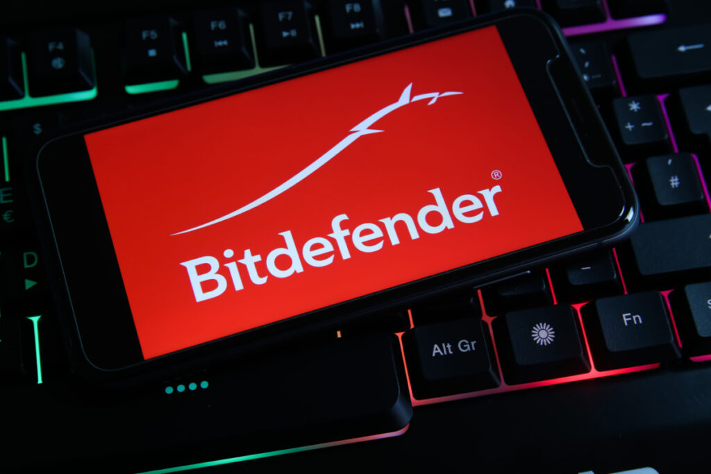 Closeup of a smartphone with logo lettering of Bitdefender, representing the data breaches report.
