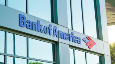Bank of American sign outside glass building