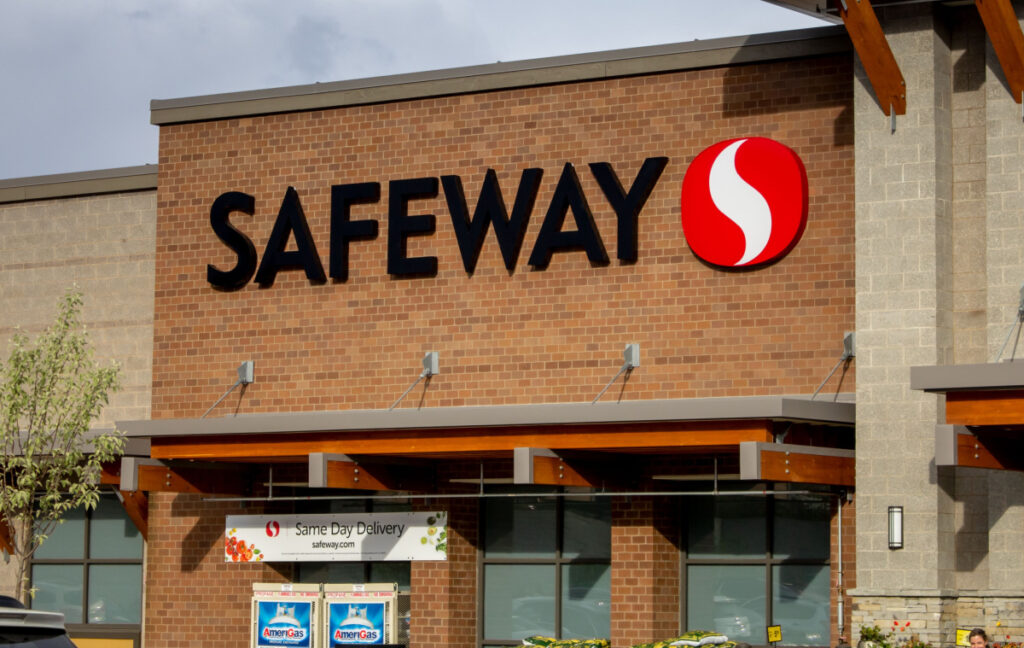 A view of a store front sign for the grocery store chain known as Safeway representing the Safeway BOGO class action lawsuit settlement.