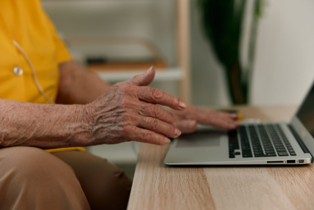 Elderly person using a computer, representing the Independent Living Systems data breach class action