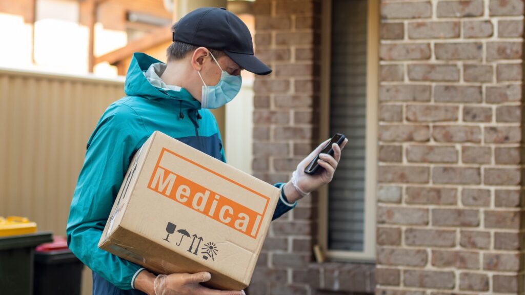 A man delivers medical supplies, representing the NuLife Med data breach class action settlement.