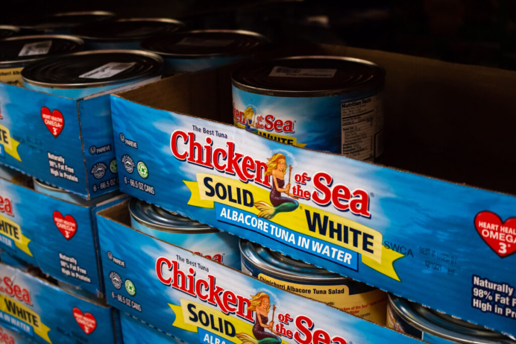 Chicken of the Sea box on store shelf representing the Chicken of the Sea tuna antitrust class action lawsuit settlement.