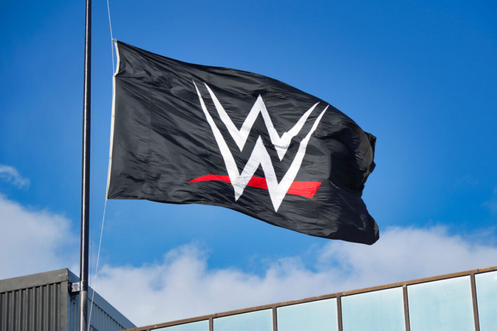 A WWE flag flying outside, representing the McMahon sexual misconduct investigation