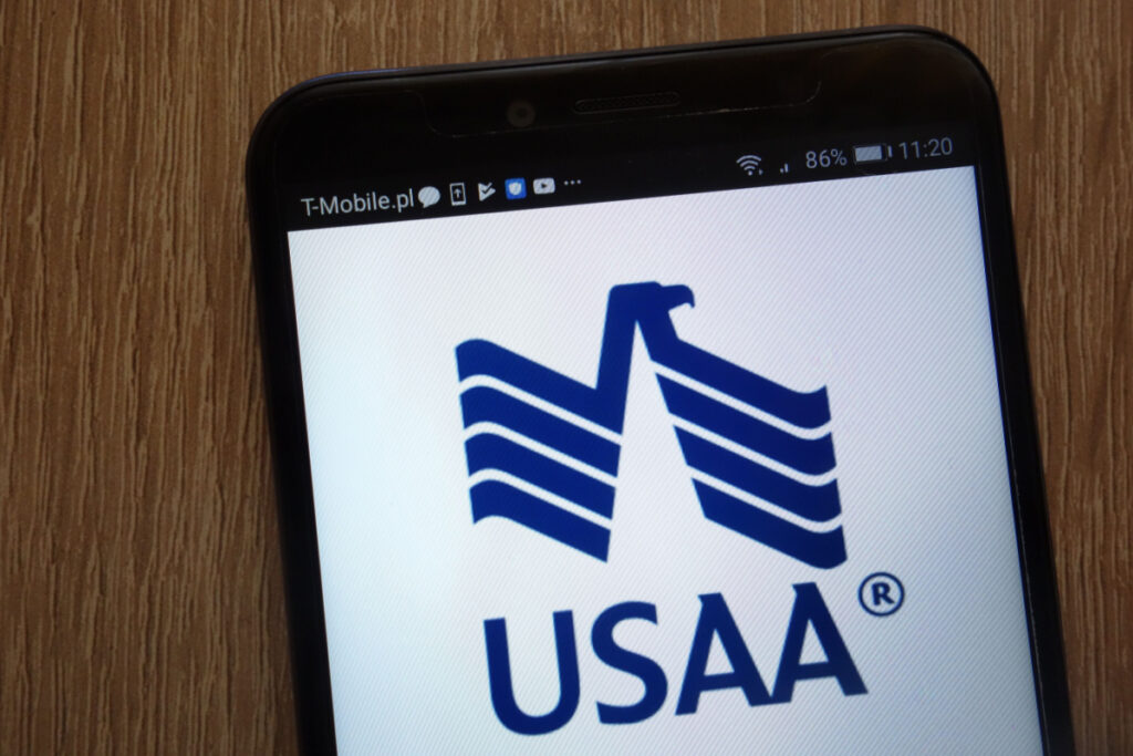 USAA logo displayed on a modern smartphone, representing the USAA collision coverage class action.