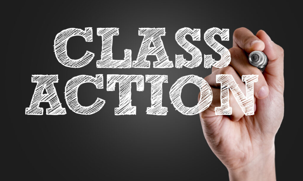 Hand writing the text: Class Action representing recent class action rebates.